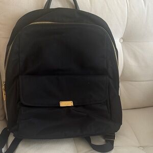 Tumi Black Backpack with Gold Accents